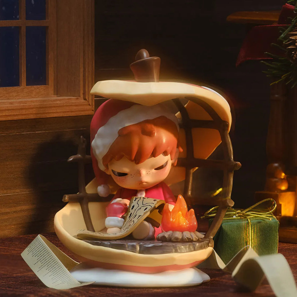 Hirono in a Santa hat sitting inside a pumpkin with a candle, surrounded by a cozy indoor setting.