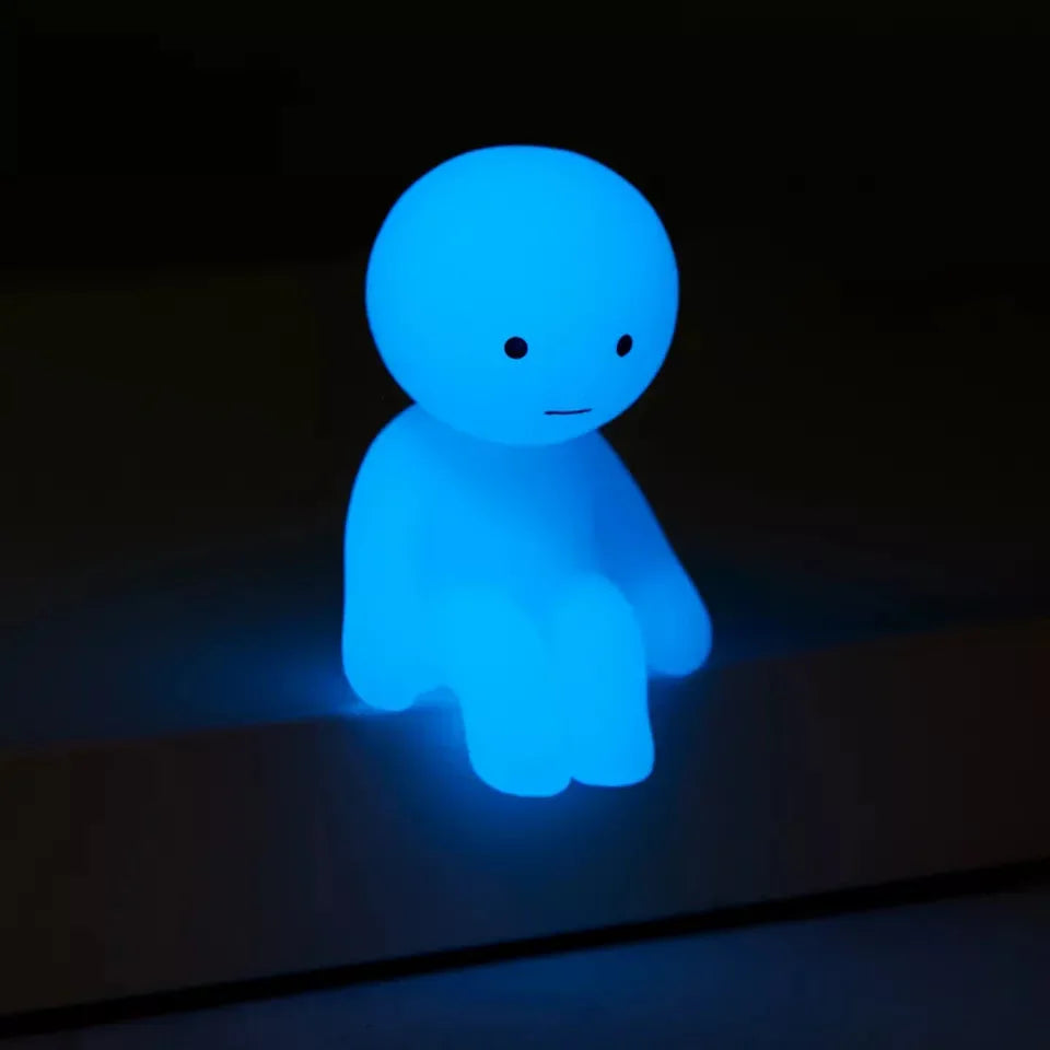 Blue glowing figure on a black background