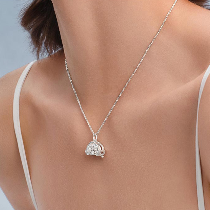 POPOP Dimoo Cloud Song Shell Dreamland Necklace on a person wearing a white top against a light gray background