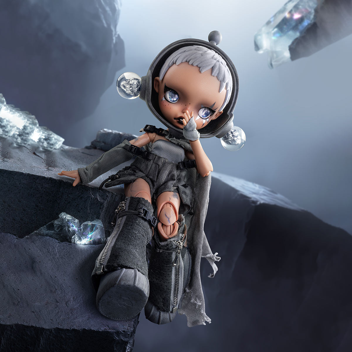 SKULLPANDA × HAMCUS 1/6 Action Figure in a futuristic outfit sitting on a rocky surface with crystals around