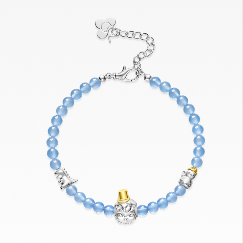Bracelet with blue beads and decorative charms on a white background