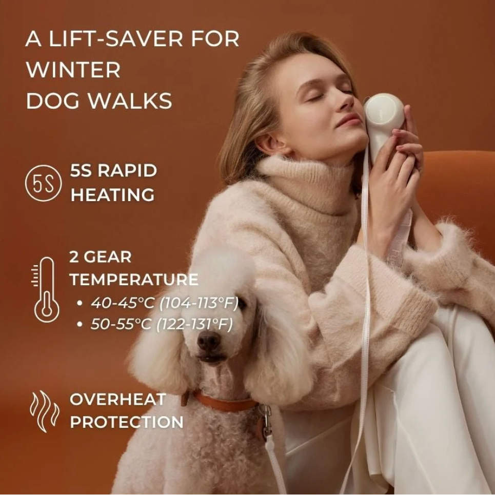 A woman and a small poodle sit on an orange sofa using a handheld pet leash with warmer. The image includes marketing text highlighting rapid heating, two temperature settings, and overheat protection.
