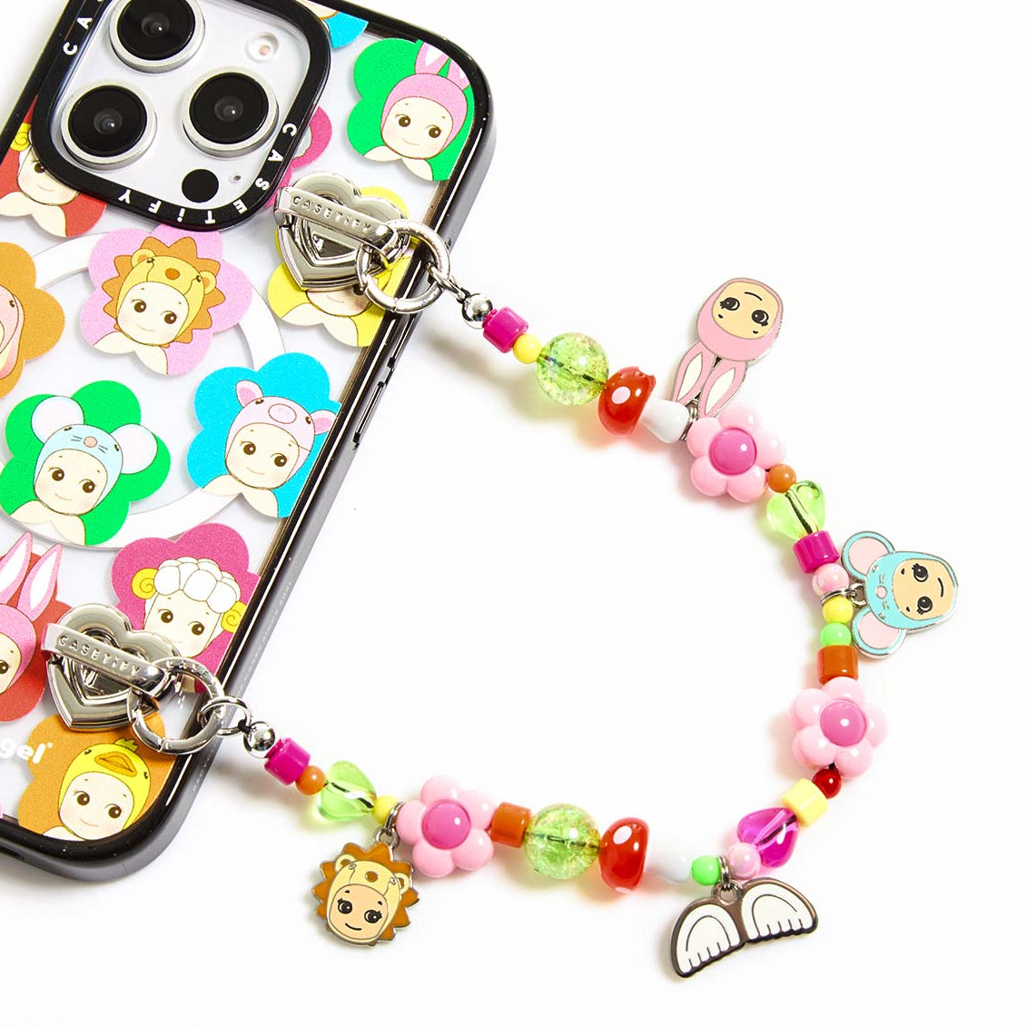 Phone case with colorful charm and beaded strap on a white background