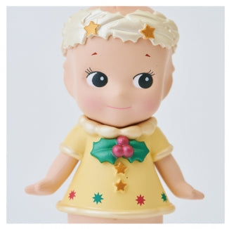 Two identical dolls in yellow dresses with floral headbands on a white background