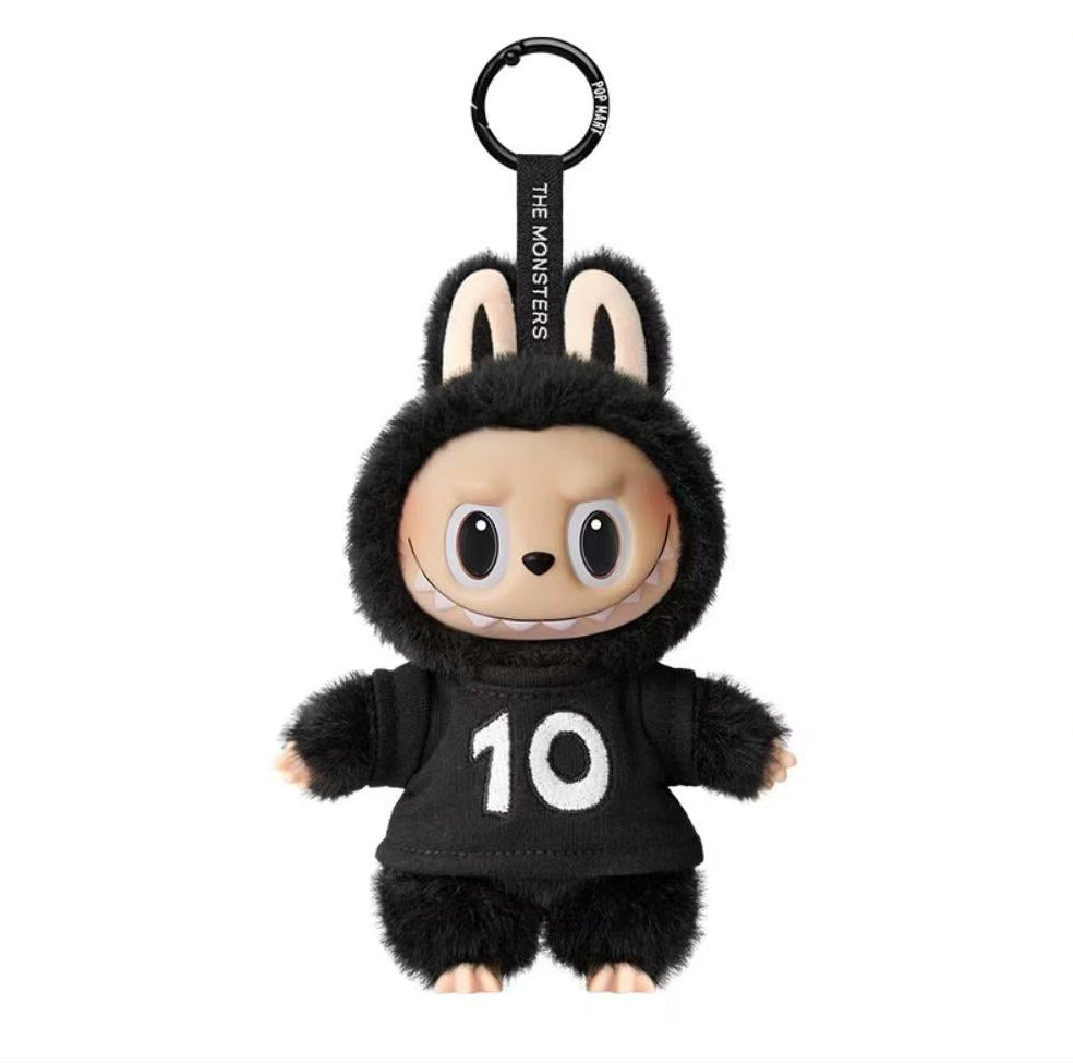 Plush keychain with a black outfit and number 10 on a white background