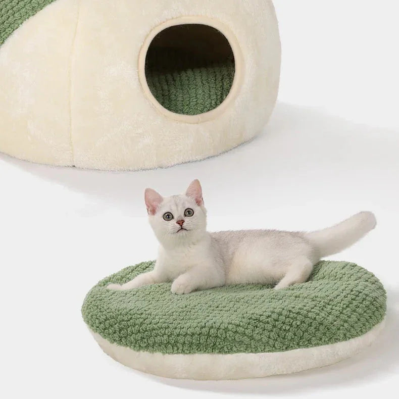 Cat nest with removable inner pad, frog design, and text about bacterial growth reduction.
