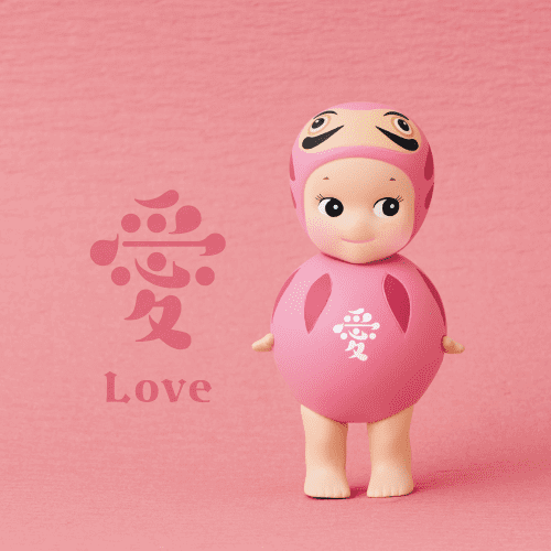 Two sonny angels, one pink and one blue, on a pink and blue background with Chinese text and English translation.