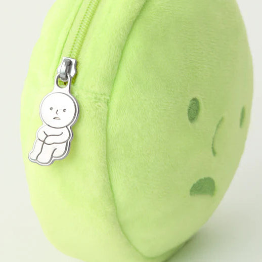 Light green round pouch with a smiley face design and a small charm on a white background