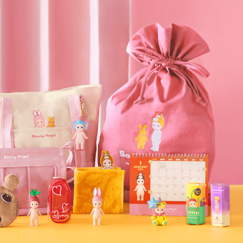 Sunny Angel Happy Bag 2026 with various items on a pink and yellow background
