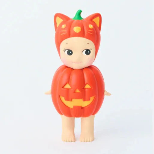 Two toy figures: one in a pumpkin costume and the other as a pumpkin, on a white background.