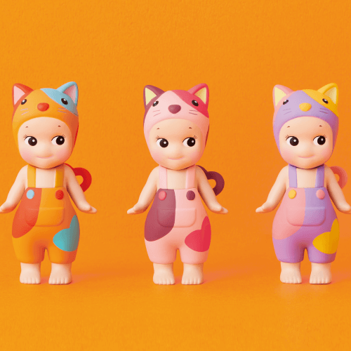 Three colorful lucky figures on an orange background with text indicating '3 styles' and 'Lucky Figures'.