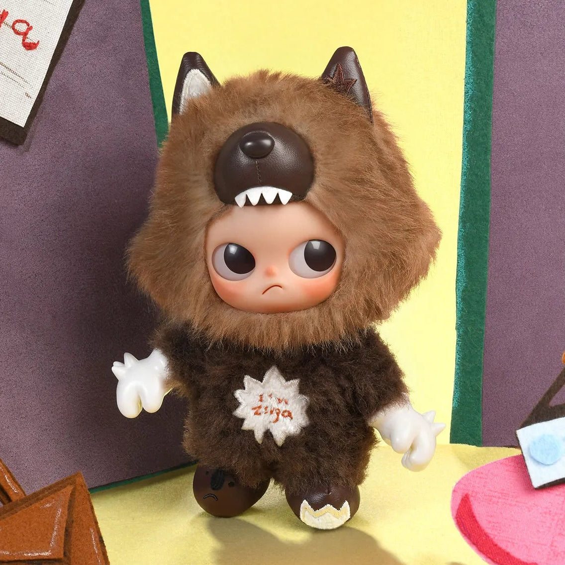 Toy figure of a character in a brown outfit with a sad expression on a colorful background